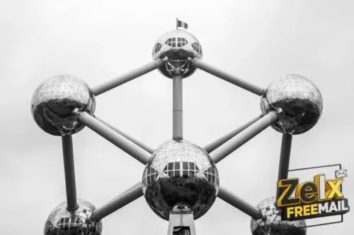 a black and white photo of a structure with mirrored balls