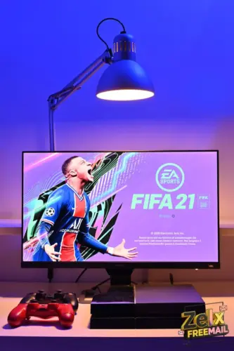 black flat screen tv turned on displaying man in blue and red jersey shirt