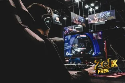 person sitting on gaming chair while playing video game