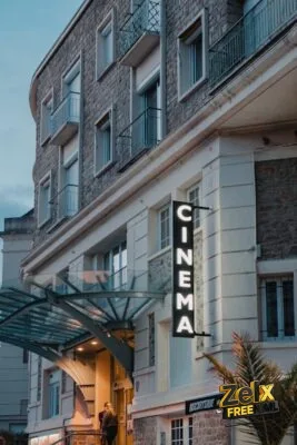 a building with a sign that reads cinema