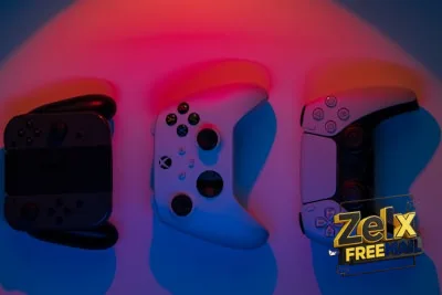 a group of three video game controllers sitting next to each other