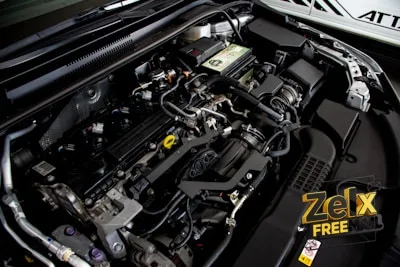 the engine compartment of a car with its hood open