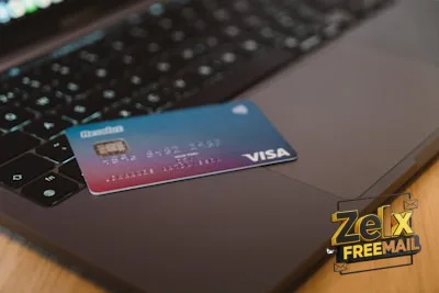 blue and white visa card on silver laptop computer