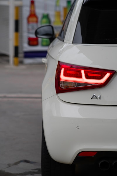 a close up of the tail light of a white car