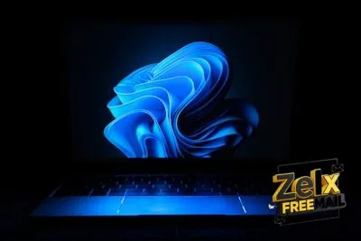 a macbook air laptop in the dark